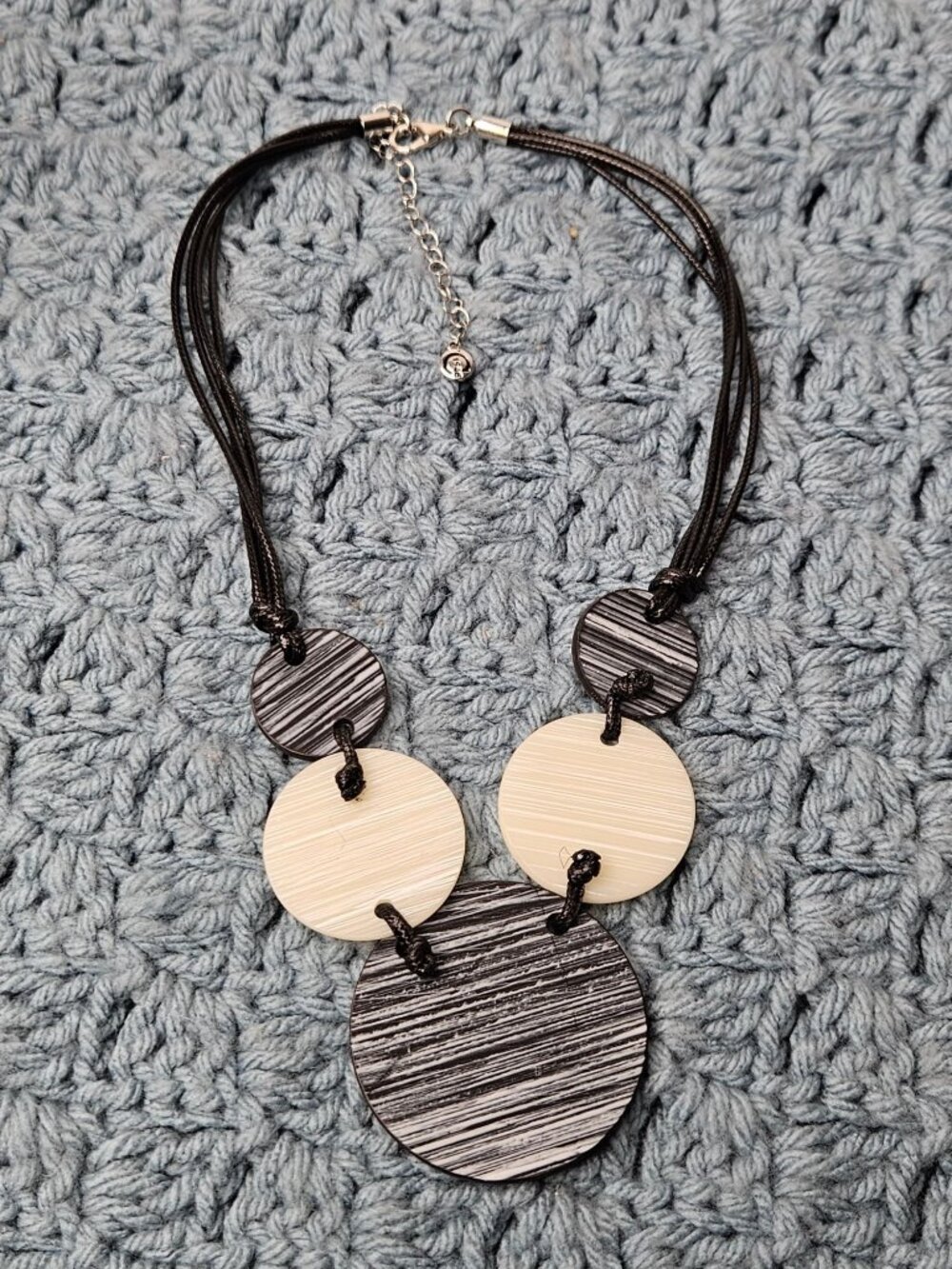 Cato Statement Bib Necklace Plastic Disks Black Cord Beige Silvertone 17-20 in